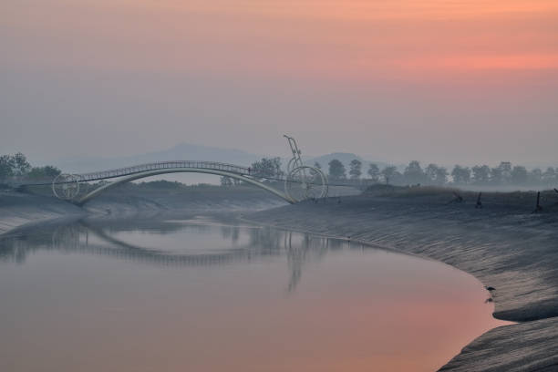 istock The dawn and reflection of bicycle bridge 1378927754