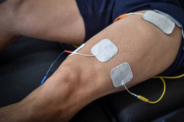 istock Muscle stimulator device with electrodes applied to quadriceps by a professional physiotherapist 1378948078