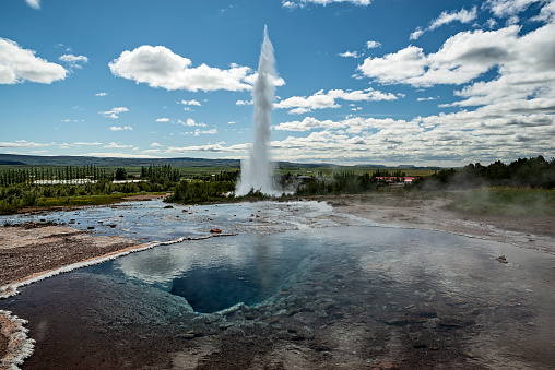 Eruption of the Geysir in Iceland in a sunny day