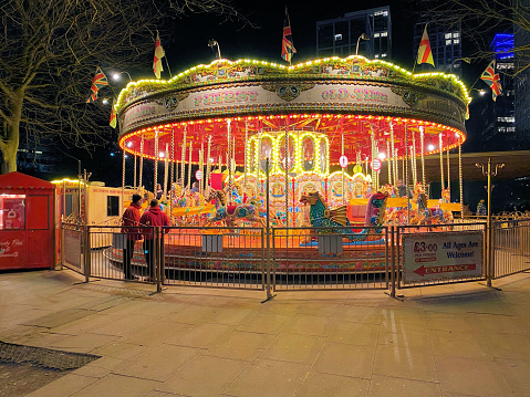 A view of a Carousel in London at night in February 2022