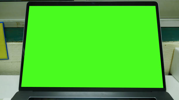 istock Close up laptop green screen. 1378960797