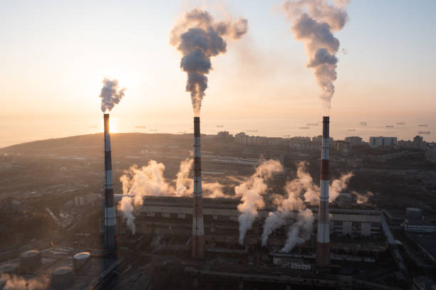 istock A factory with chimneys that emit smoke. 1378962873