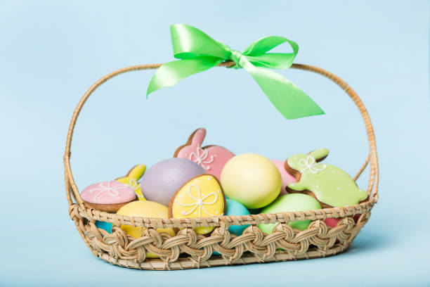 istock Colorful easter cookies in basket with Multi colors Easter eggs on colored background . Pastel color Easter eggs. holiday concept with copy space 1378974161