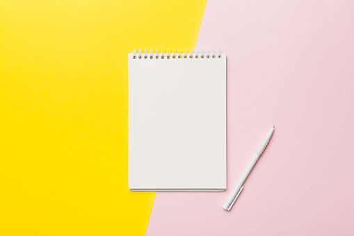 Blank notebook with pen on white background. Back to school and education concept.