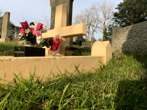 istock Gravestone with in loving memory inscription 1378977448