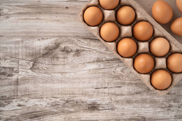istock Fresh brown chicken eggs in a kraft paper egg carton. 1378982775