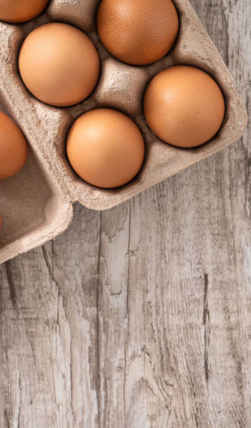 istock Fresh brown chicken eggs in a kraft paper egg carton. 1378982788
