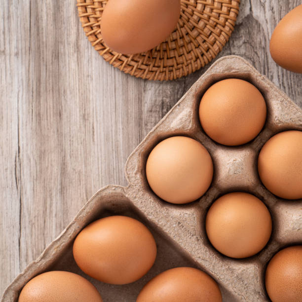 istock Fresh brown chicken eggs in a kraft paper egg carton. 1378982795