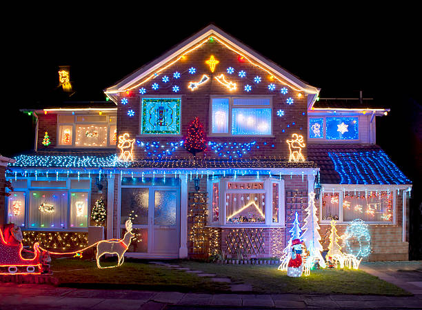 House colorfully decorated with bright Christmas lights Christmas Lights on the outside of a house christmas lights house stock pictures, royalty-free photos & images