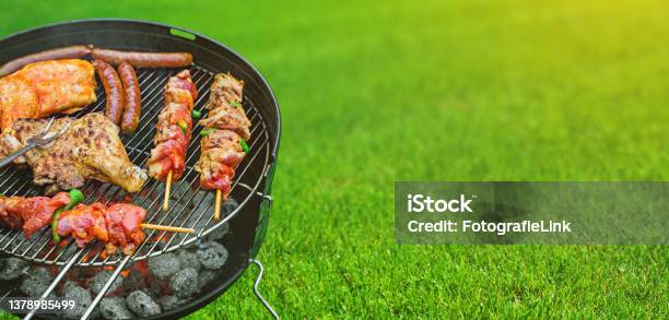 Delicious Grilled Meat With Vegetables Sizzling Over The Coals On Barbecue Stock Photo - Download Image Now