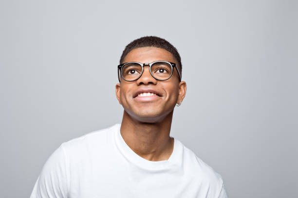 istock Headshot of happy young man 1378993991