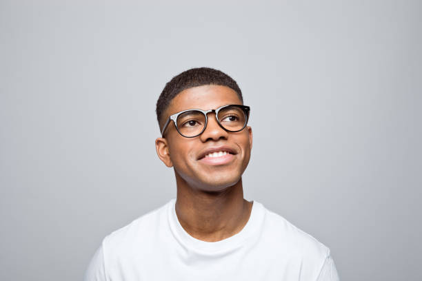 istock Headshot of happy young man 1378994519