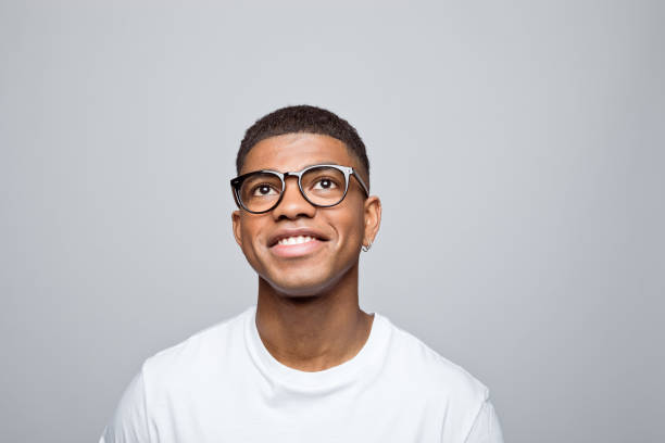 istock Headshot of happy young man 1378994734