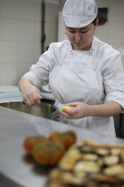 istock Master chef and cooks preparing food in a restaurant 1378998235
