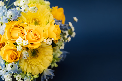Artificial flowers in a colorful composition