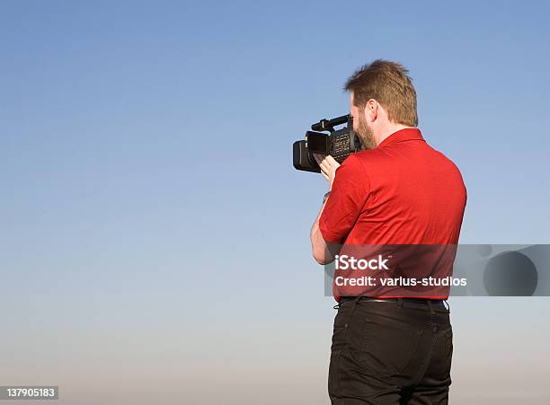 Videographer Shooting Footage Stock Photo - Download Image Now - Adult, Beard, Blue