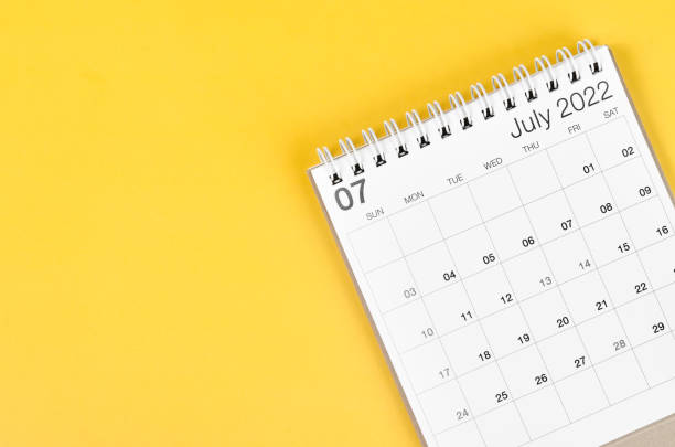 istock July 2022 desk calendar on yellow background with empty space. 1379071750