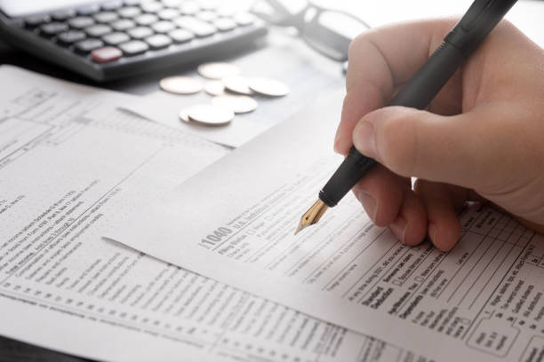 istock Tax return concept wits US 1040 tax form 1379073915