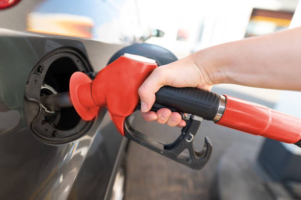 istock Vehicle fueling facility at petrol station 1379074437