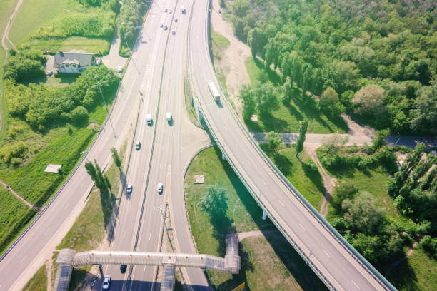 istock Road interchange or highway intersection with busy urban traffic 1379076024