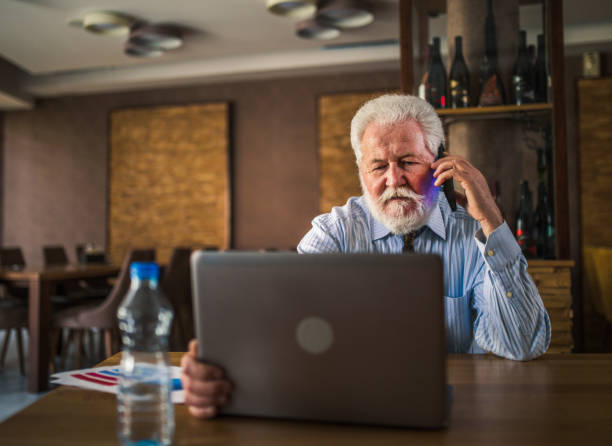 istock senior business man at restaurant 1379088574