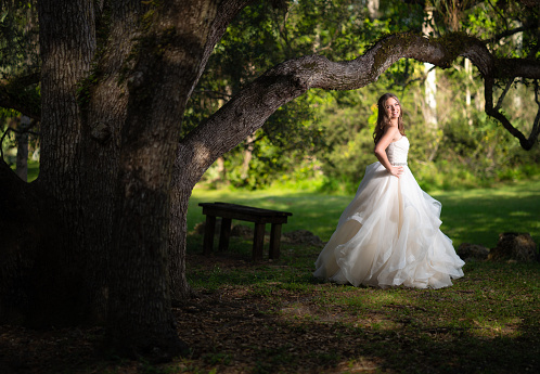 Quinceanera wearing a white dress at a park in Florida