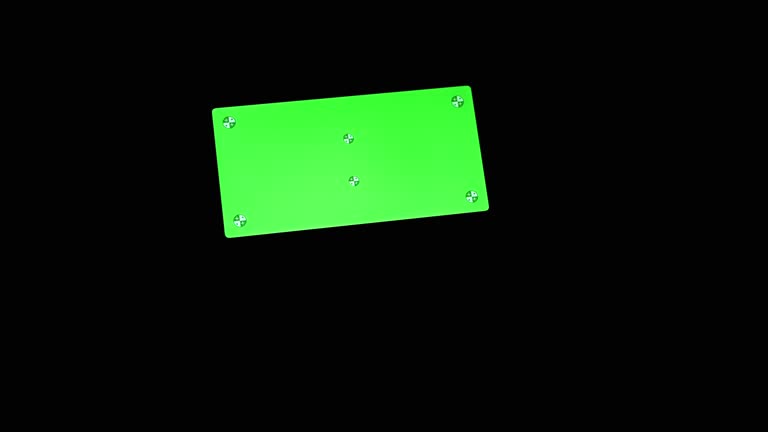 Silhouette of a Black Hand Touches a Smart Phone with a Green Screen in a Dark