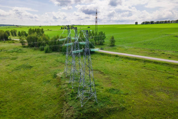 istock Transmission tower supporting an overhead high voltage power line. 1379099475
