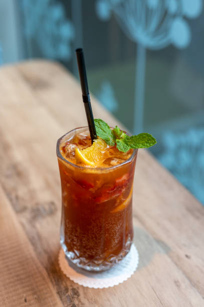 istock Glass of ice tea on wooden table 1379106620