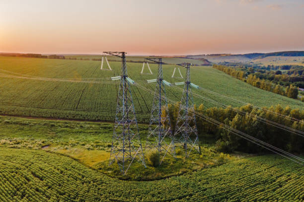 istock Overhead power line transmission tower at sunset. 1379108324