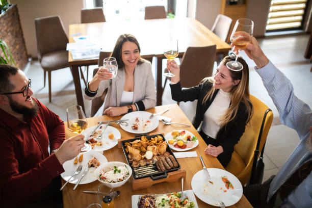 istock group of business people having fun on a lunch 1379108912