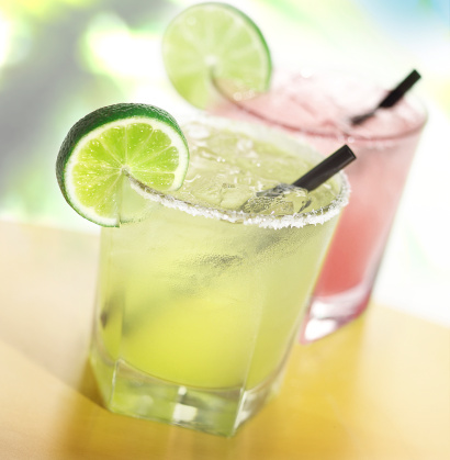 Two margaritas with limes