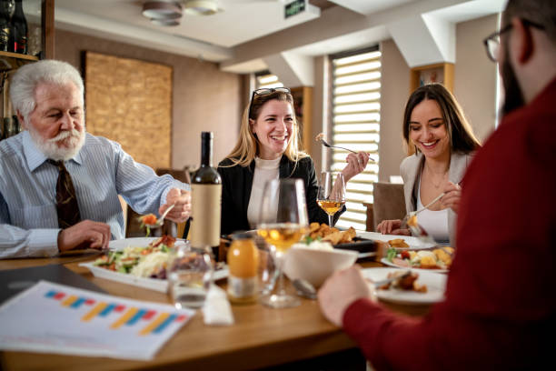 istock group of business people having fun on a lunch 1379110816