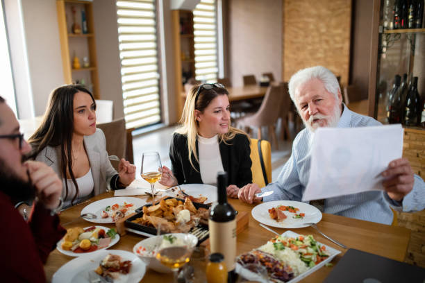istock group of business people having fun on a lunch 1379111872