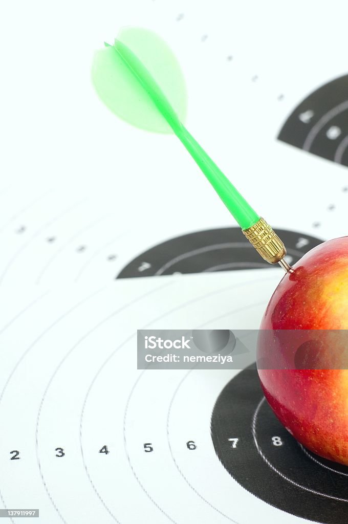 Darts in apple. Darts in apple.Concept of success. Accuracy Stock Photo