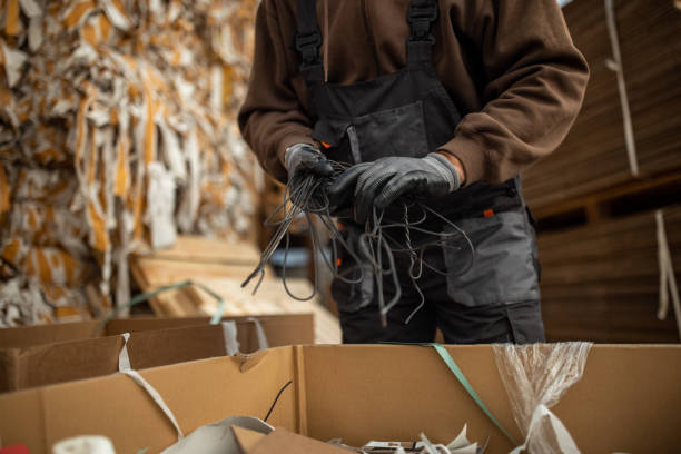 istock Unrecognizable senior male worker separates the material for recycling 1379128702