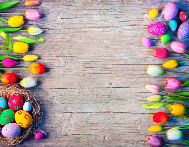 istock Easter Board With Eggs Decoration And Tulips On Natural Wooden Table 1379136221