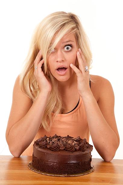 istock Woman with cake and shocked expression 137913675
