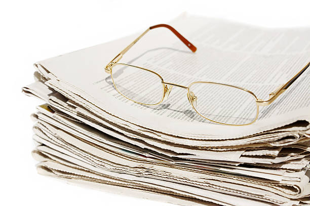 istock Pile of newspapers and glasses 137913855