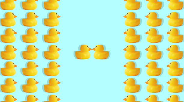 istock pattern of yellow rubber ducks on a blue background 1379141731