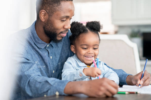 istock Father Coloring with his Daughter 1379141790