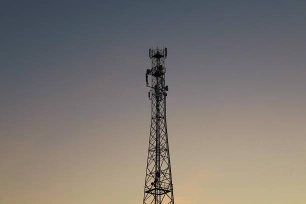 istock Metal telephone tower. Close-up. Black silhouette. Background. Texture. 1379160656