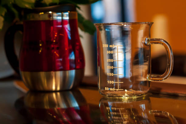 istock Glass measuring cup on a counter. 1379174050