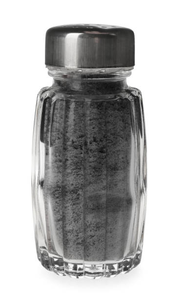 istock Ground black salt in shaker isolated on white 1379185594
