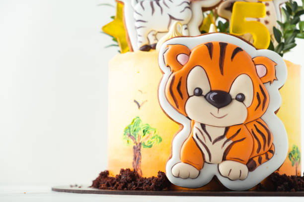 istock Africa cake with tiger and zebra cookies on the white background 1379199021