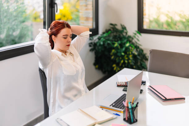 istock Young girl getting up at work from home 1379210209
