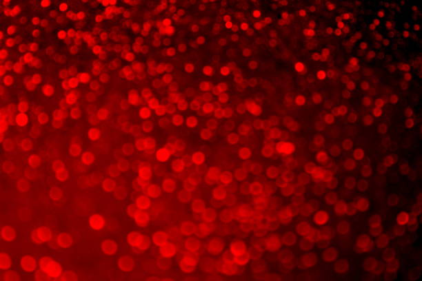 istock Blurred abstract photo with red sparkles. 1379215319