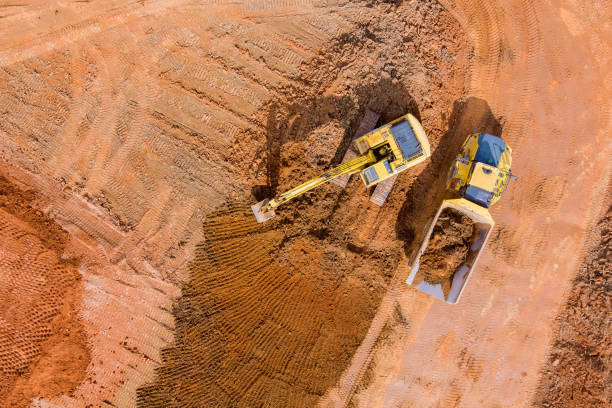 istock Excavation and loading onto dump trucks with excavators work construction equipment for earthworks 1379220784