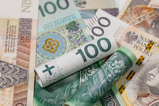 Polish money. Polish zloty banknotes placed next to each other and are the backdrop to many various financial matters. PLN currency.