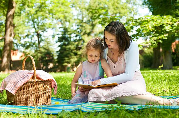 istock Mother and child - reading book 137925414